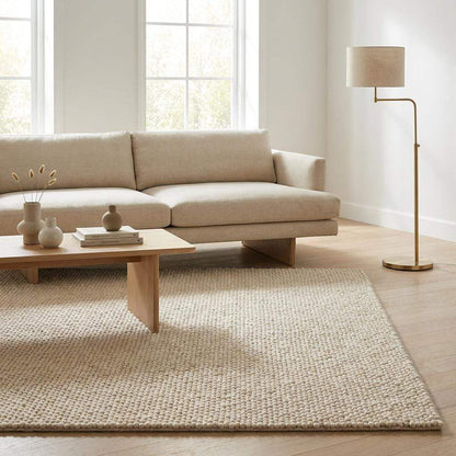Ivory chunky wool area rug with thick looped texture in modern minimalist living room