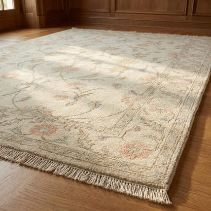 Ivory floral wool rug with pastel flowers and low-profile pile for living room decor