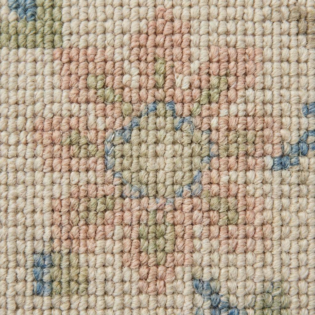 Ivory floral wool rug with pastel flowers and low-profile pile for living room decor
