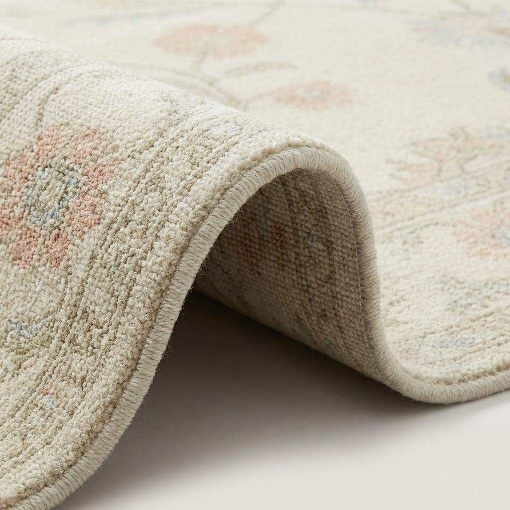 Ivory floral wool rug with soft neutral base and delicate pastel flowers for living room decor