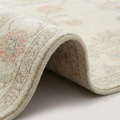 Ivory floral wool rug with soft neutral base and delicate pastel flowers for living room decor