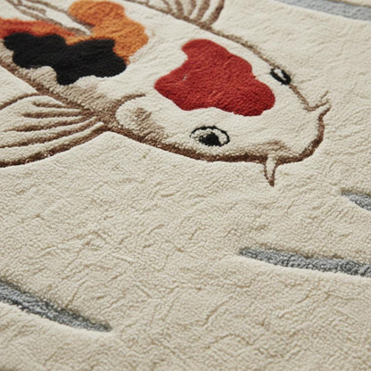 Close-up of koi fish rug texture showing soft pile fibers, stitched fish details, water ripple pattern, and high-quality craftsmanship on a cream background for a plush decorative area rug.