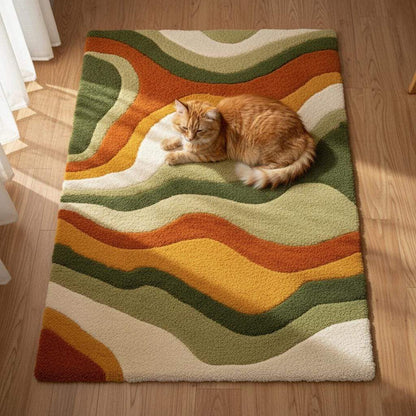 High pile shag tufted rug, abstract waves in warm fall colors, shown in staged lounge setting.