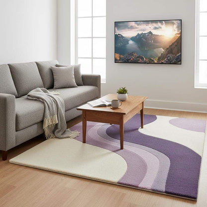 Modern lavender area rug with curvy stripe pattern and plush tufted surface