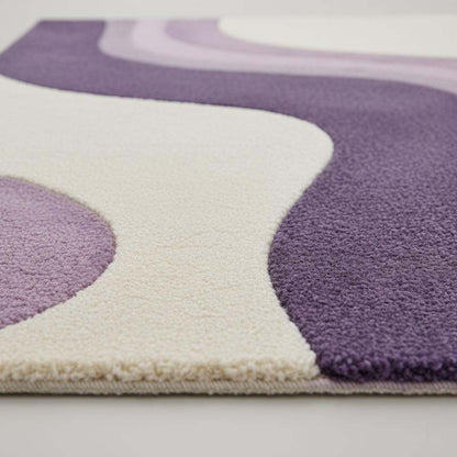 Lavender area rug with modern retro curvy stripe pattern and plush tufted surface in pastel purple and cream colors