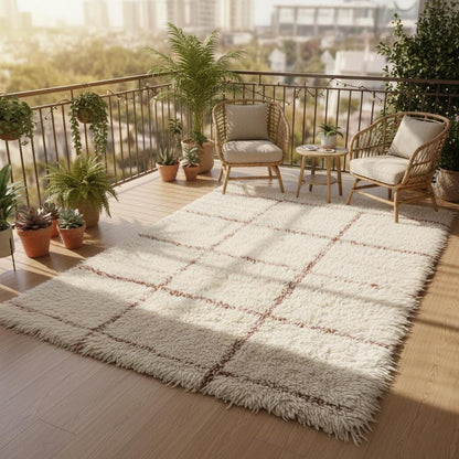 Ivory shag rug with plush surface and subtle patterning, premium cozy carpet for contemporary neutral home décor.