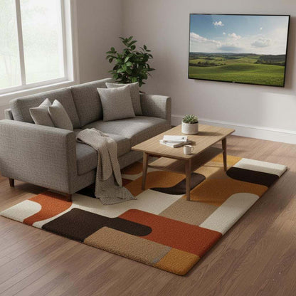 Mid century modern rug with geometric retro design in warm orange, yellow, brown, and cream tones, soft tufted texture, and durable construction.