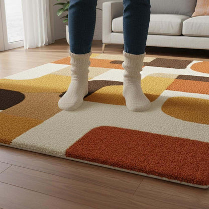 Mid century modern rug with geometric retro design in orange and yellow tones, soft tufted texture and durable construction