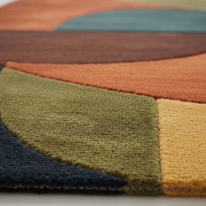 Handmade mid century modern rug with retro geometric wool design in navy, mustard, burnt orange, and olive hues