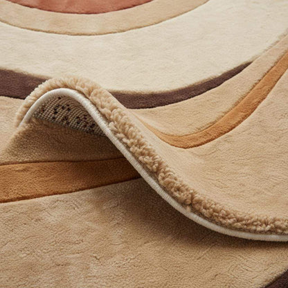 Close-up of hand tufted rug texture showing plush pile height, dense fibers, soft wool surface, and clean carved edges highlighting craftsmanship and comfort.