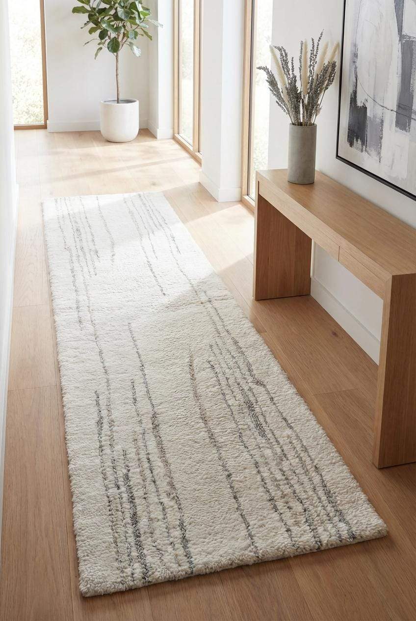 Minimalist cream runner rug with subtle gray accents in modern hallway decor