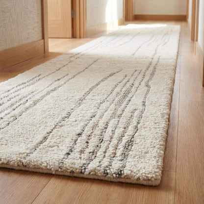 Minimalist cream wool runner rug with subtle gray accents in modern kitchen hallway interior