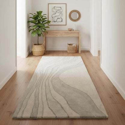 Rectangular runner rug featuring flowing wave lines, clean edges, and a calm neutral color palette.