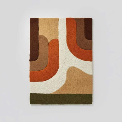 Earth tone plush rug with soft high pile and abstract mid-century design in warm geometric colors
