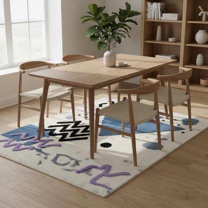 Abstract geometric rug with pastel blue and lavender shapes on a soft bouclé textured ivory base