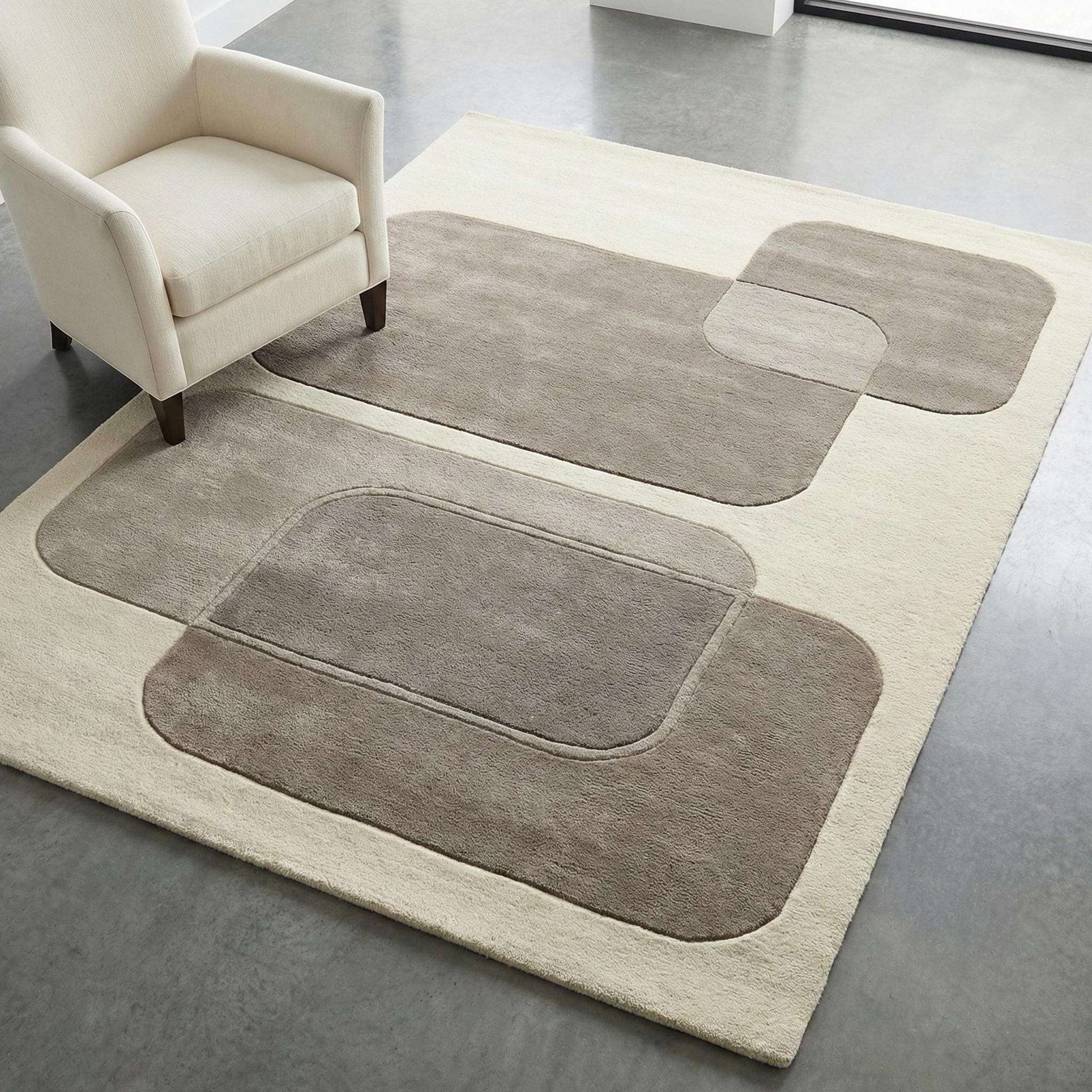 Modern abstract area rug with neutral geometric design and plush texture for minimalist living room decor