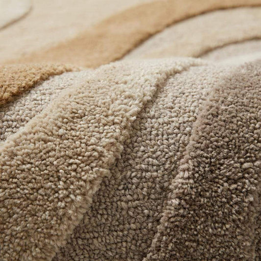 Close-up of hand tufted wool rug showing carved high-low pile texture and soft dense fiber surface __etsy:7869667710