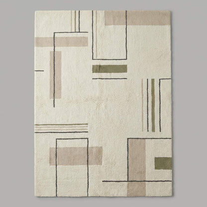 Modern geometric area rug in cream with charcoal lines and sage green blocks, minimalist neutral rug for living room decor