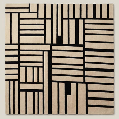 Contemporary black and cream geometric wool area rug placed under accent chair in modern minimalist living room