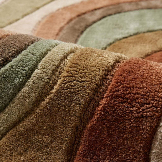 Close-up of hand tufted wool rug showing soft plush pile and carved wave texture in earth tone colors __etsy:7892547167