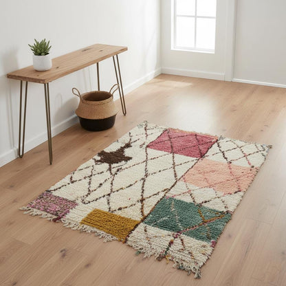 Colorful modern Moroccan rug with geometric shag and Berber diamond patterns on wooden floor