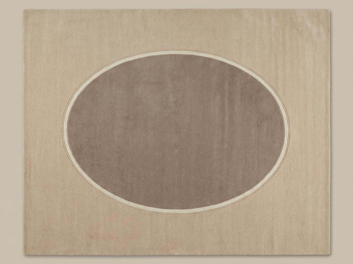 Modern neutral oval hand-tufted wool rug in beige and taupe for living room decor