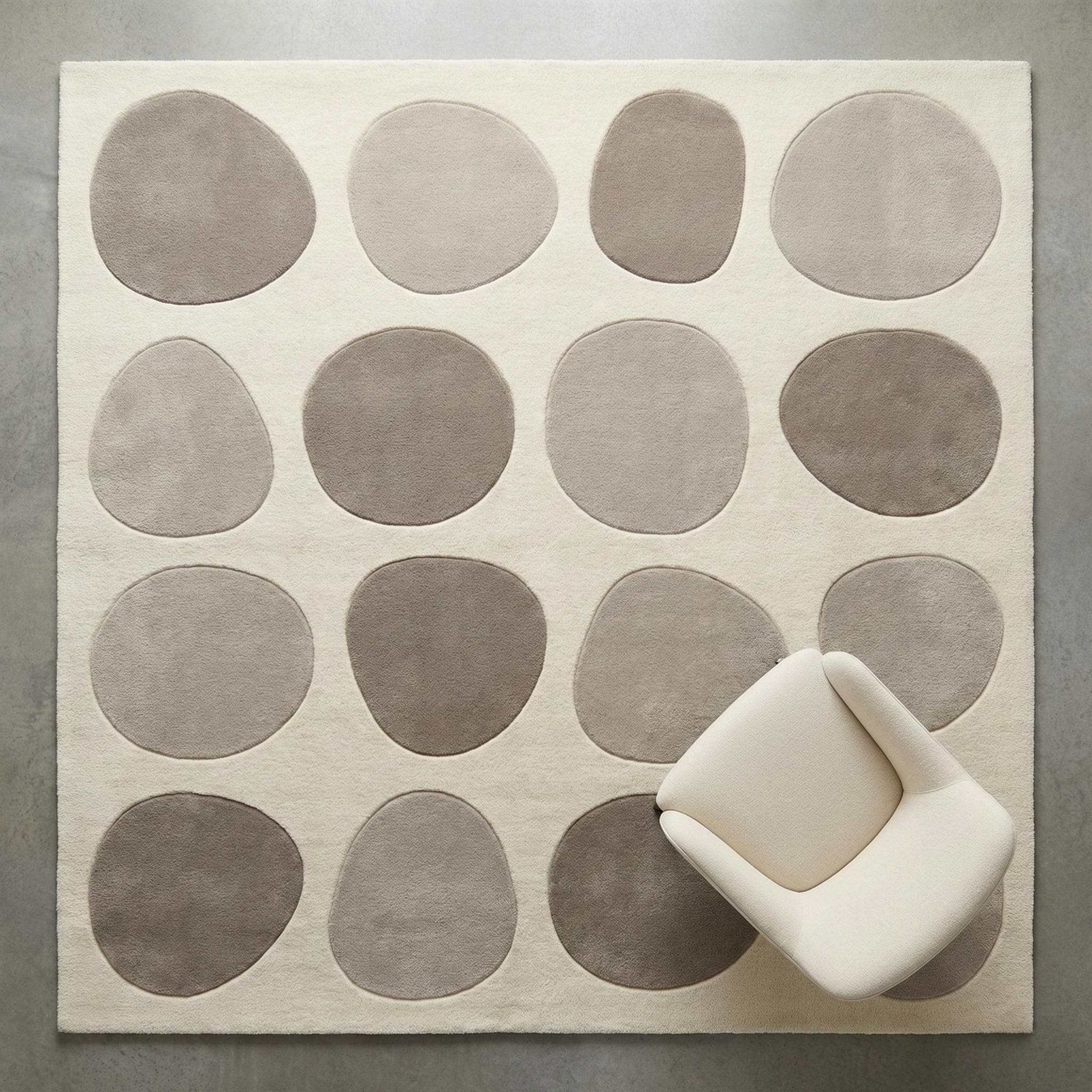 Modern pebble pattern tufted wool area rug with neutral tones in minimalist living room