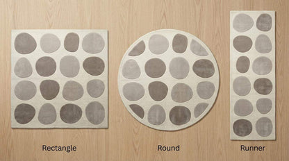Modern pebble pattern tufted wool area rug in neutral tones for minimalist living room decor