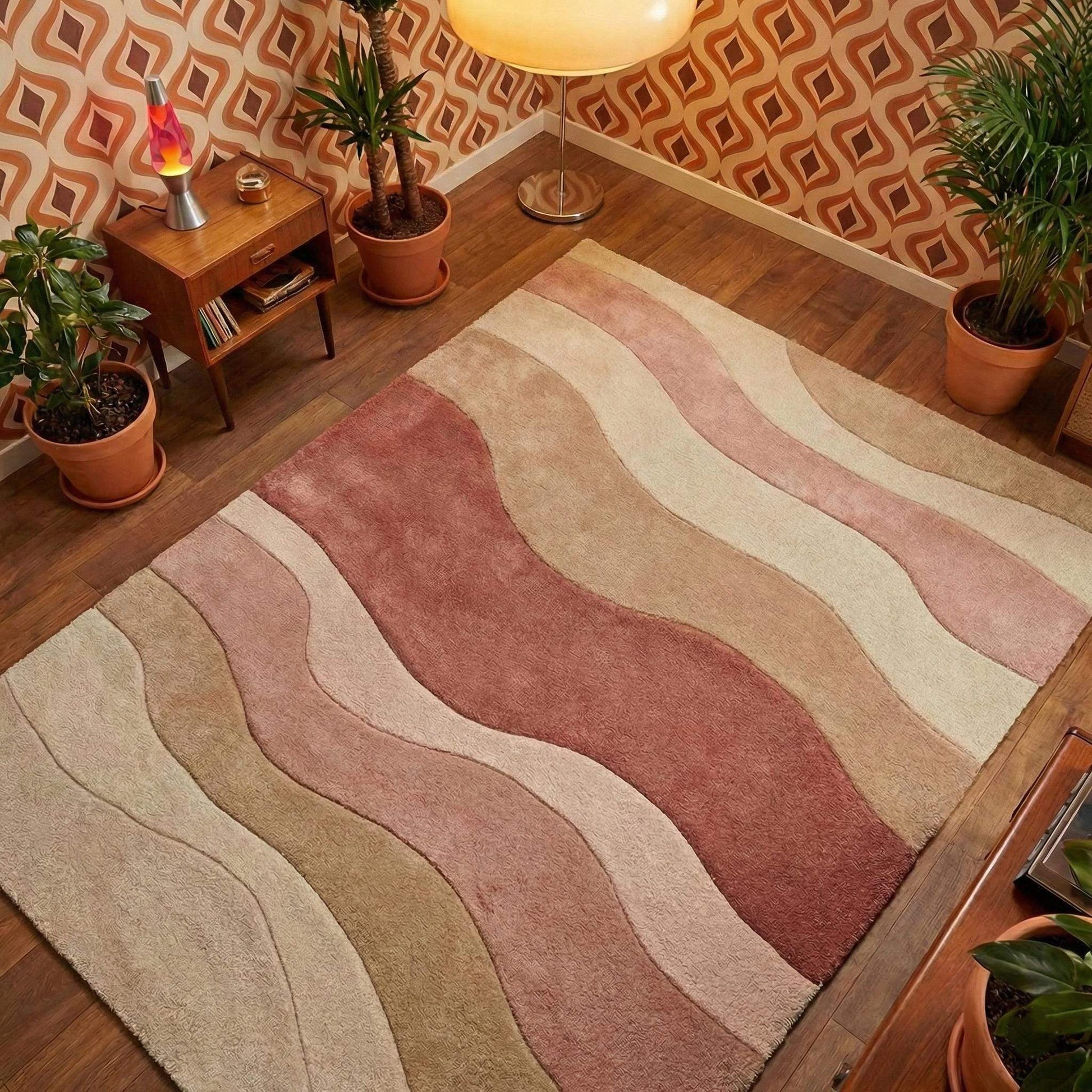 Blush-pink modern wave pattern rug with cream-beige tones in cozy living room setting