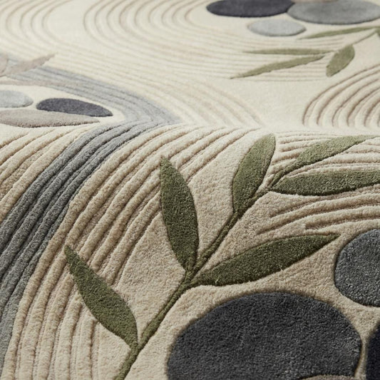 Close-up of textured modern abstract rug showing carved high-low pile, soft fibers, neutral tones, and stone-inspired pattern detail