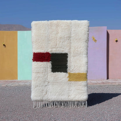 Moroccan Beni Ourain ivory wool rug with abstract color blocks and plush shaggy texture