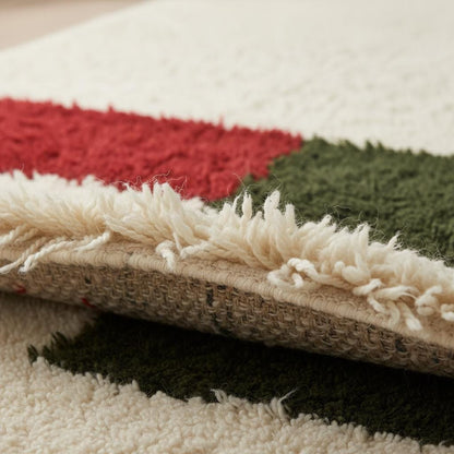 Close-up image of the thick, plush ivory pile and hand-knotted texture of the Moroccan Beni Ourain style rug.