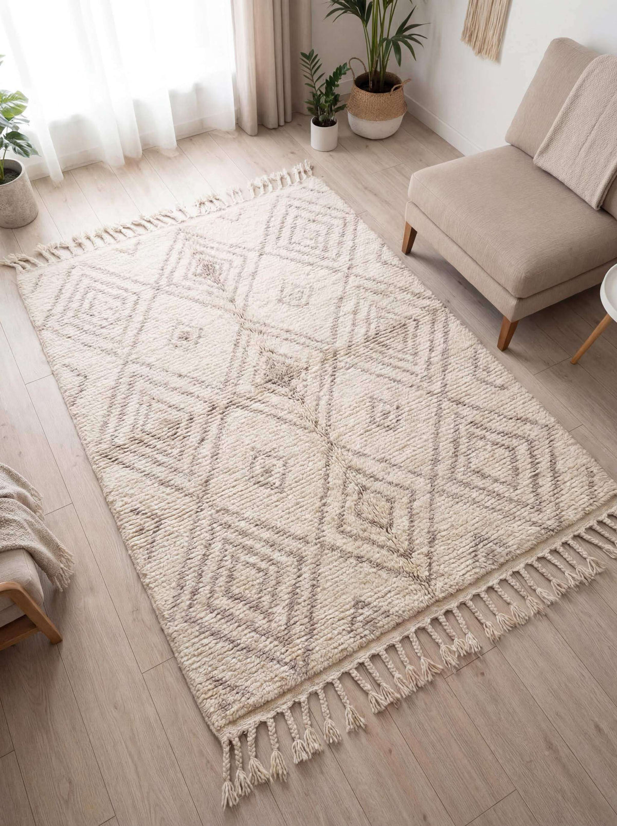 Ivory Moroccan diamond rug with tassel fringe displayed in modern living room