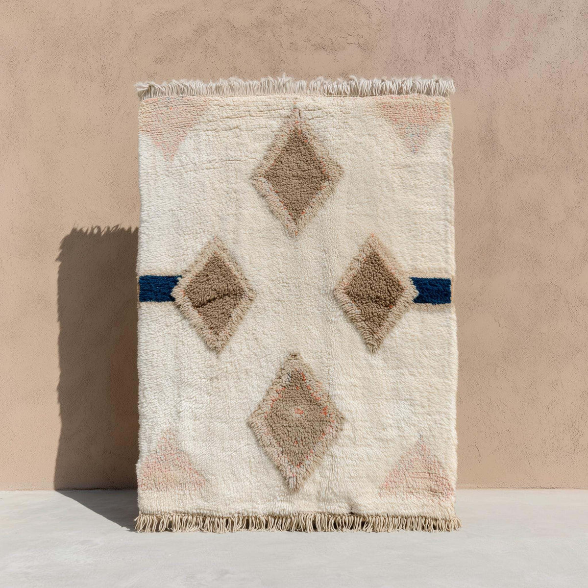 Moroccan Diamond Wool Rug in cream, taupe, and navy with plush texture and geometric boho design