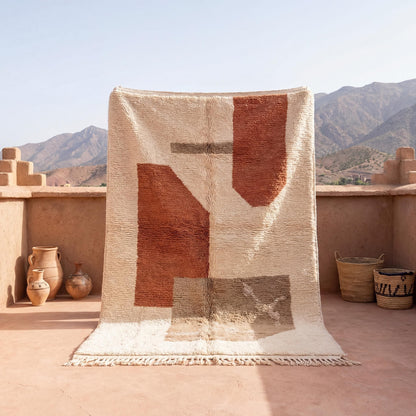Moroccan style geometric rug with ivory and terracotta abstract boho design and plush textured surface