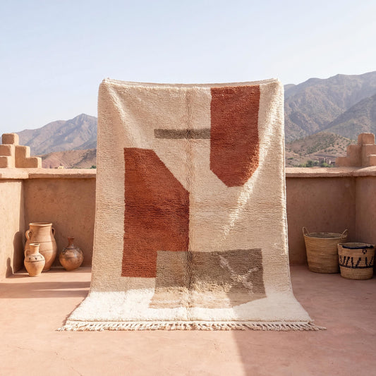 Moroccan style geometric rug with ivory and terracotta abstract boho design and plush textured surface