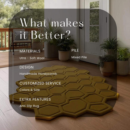 Mustard honeycomb rug with sculpted 3D hexagon pattern on wood floor in bright entryway