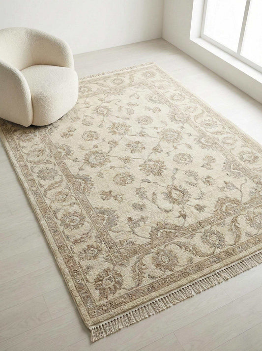 Neutral Oushak area rug hand-knotted with wool featuring a soft floral design for living room decor