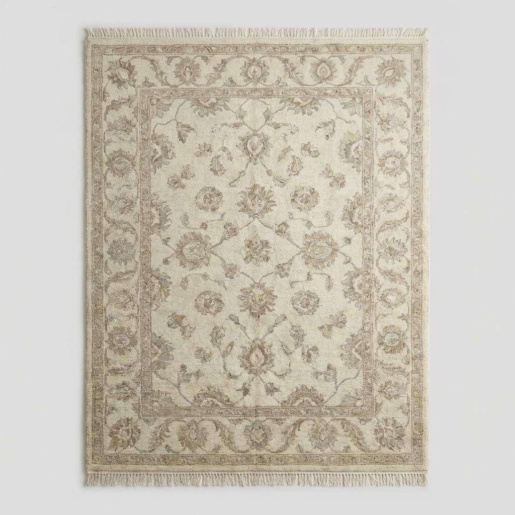 Ivory and beige wool Oushak rug with subtle floral motifs and traditional border design