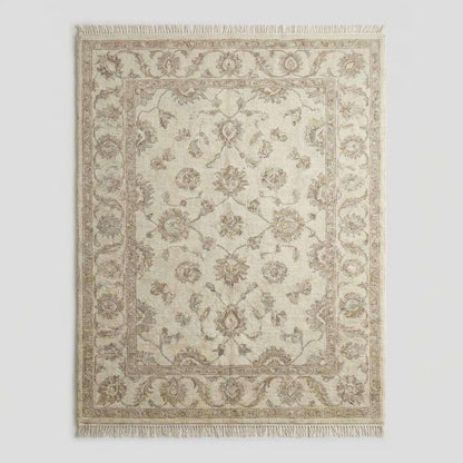 Ivory and beige wool Oushak rug with subtle floral motifs and traditional border design