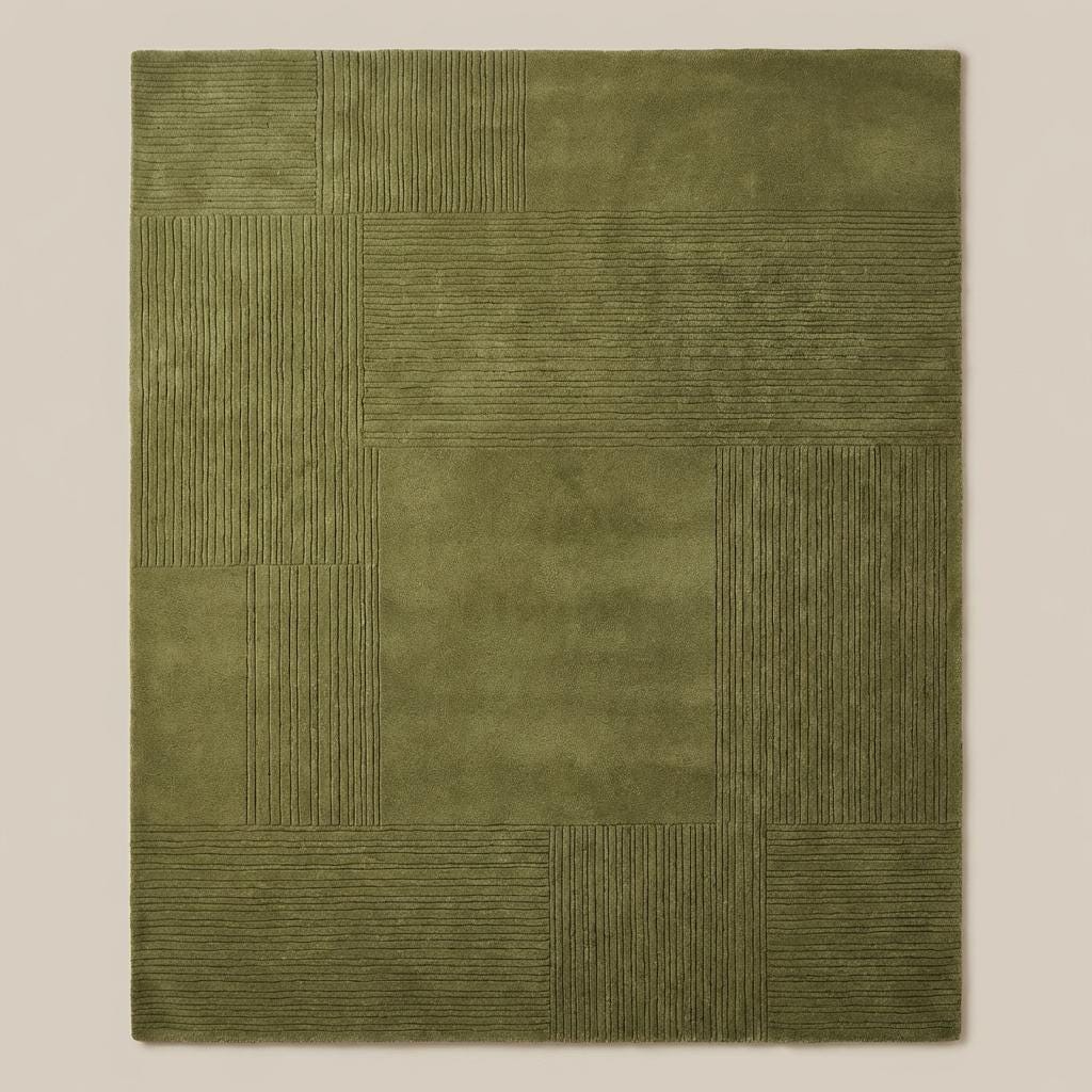 Top down view of olive green geometric patchwork rug displaying full square panel layout and textured detailing