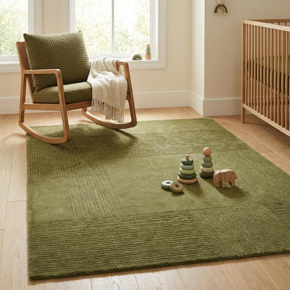 Soft olive green geometric area rug styled in cozy nursery with crib and neutral decor creating warm calming atmosphere