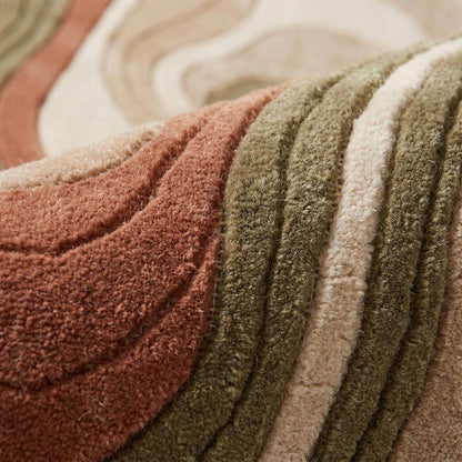 Close-up of hand tufted wool rug showing carved cut pile texture, soft plush surface and layered abstract contour detailing __etsy:7978196880