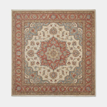 Floral medallion pattern detail of hand knotted Oushak rug with classic Persian-inspired motifs and soft color transitions.