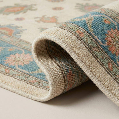 Close-up of hand knotted wool rug showing fine knot structure, soft pile texture, and natural wool fibers __etsy:7883143062
