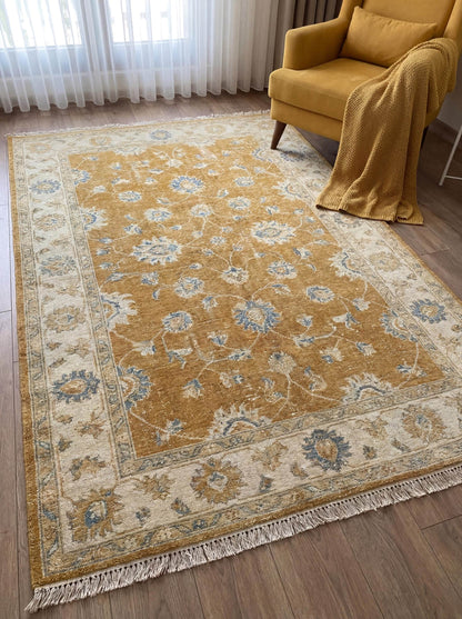 Mustard gold hand knotted Oushak rug with soft blue floral pattern placed in bright living room interior __etsy:7855078991