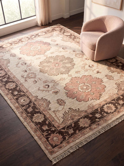 Hand knotted Oushak rug with floral medallion design in ivory and blush tones styled in a modern living room __etsy:8062259194