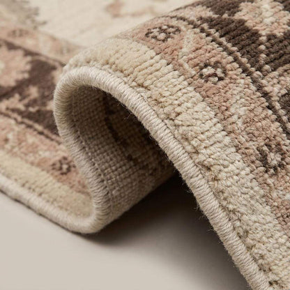Close-up of hand knotted wool rug showing soft low pile texture, floral weaving details, and artisan craftsmanship __etsy:8110174013