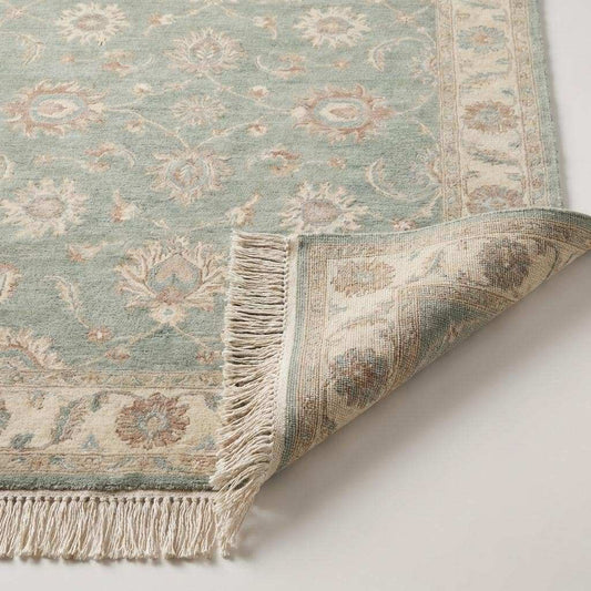 Close-up of hand knotted wool rug showing soft pile texture, visible knot density, and natural fiber detail in sage green tones __etsy:7958052327
