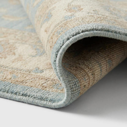 Close-up of hand knotted wool pile showing individual knots and natural fiber texture